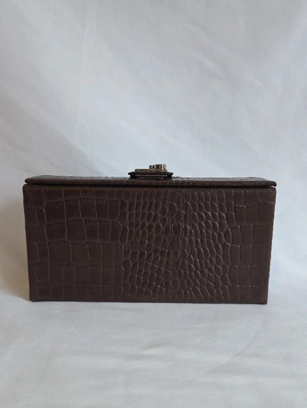 A brown crocodile-embossed faux leather jewelry and watch display box